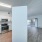 view of kitchen and living area separated by wall