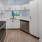 partial walls and serving windows in bright kitchen