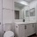 medicine cabinet in well lit bathroom