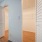lighted walk in closet with folding doors