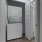 stacked washer/dryer closet next to bathroom