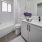 shower/tub combo in well lit bathroom